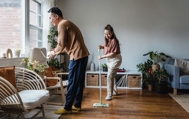 A couple cleaning their home